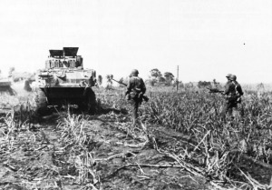 #1...27th Division troops advance behind tanks on Saipan...into what was known as "Death Valley"...